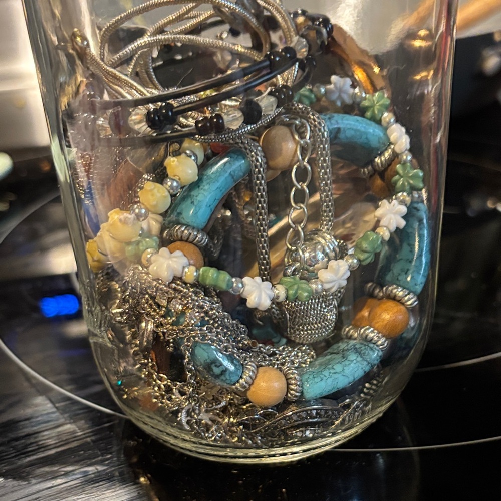 Jewelry Jar. Rings, necklaces, bracelets and watch.